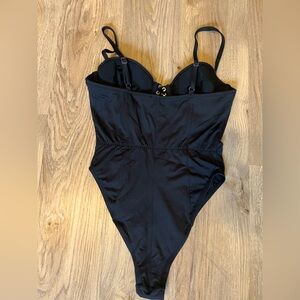 In very good condition and extra clean Fleur du mal Black Bullet Bodysuit size S